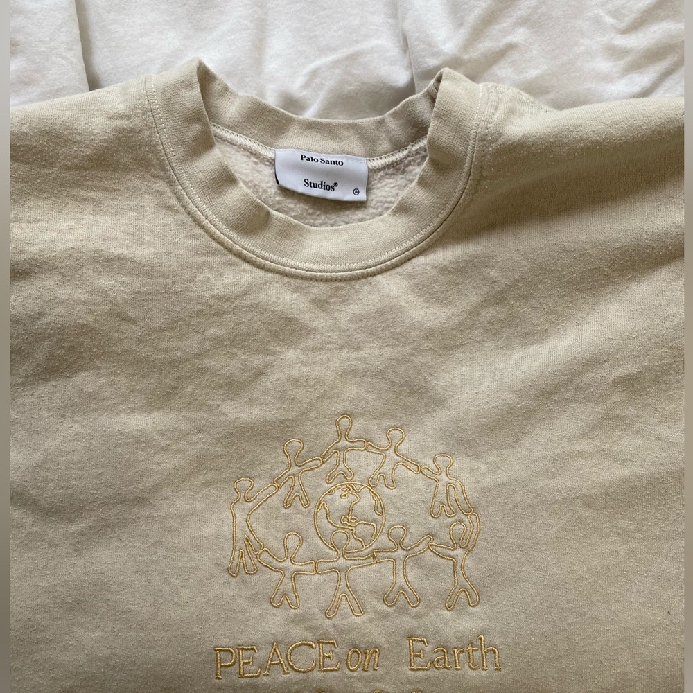 palo santo studios peace on earth crewneck